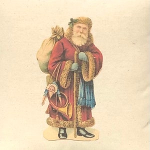 May include: A vintage illustration of Santa Claus wearing a red robe with fur trim, carrying a sack of gifts and a walking stick. He is holding a toy doll and a horn.
