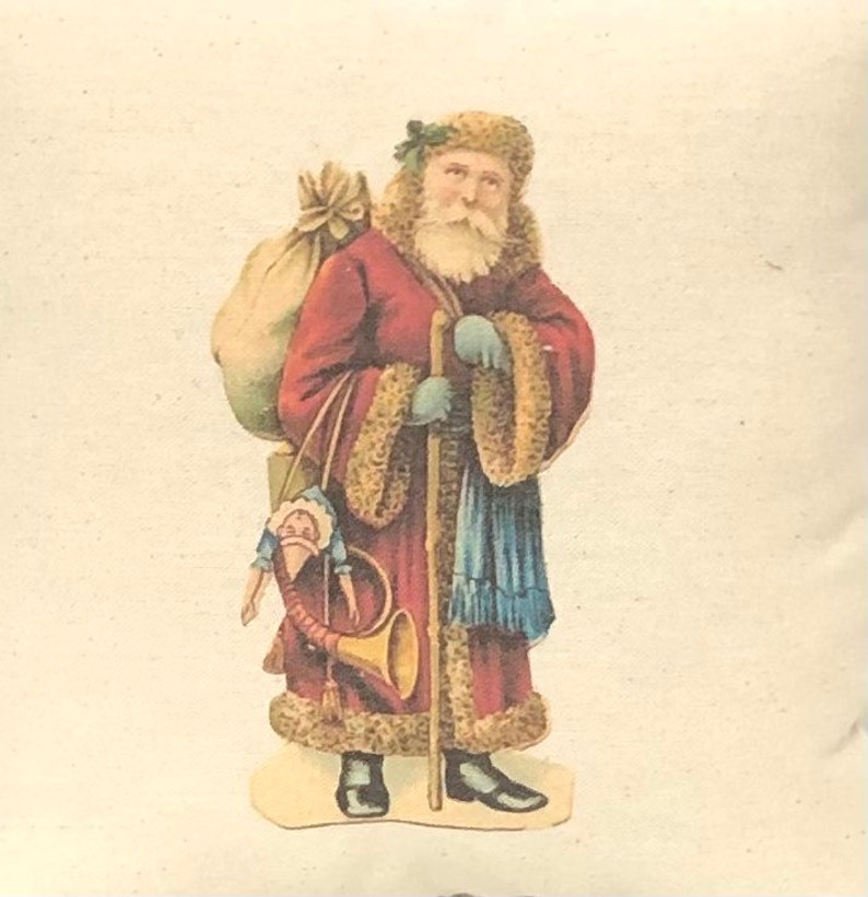 May include: A vintage illustration of Santa Claus wearing a red robe with fur trim, carrying a sack of gifts and a walking stick. He is holding a toy doll and a horn.