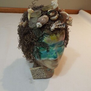 Decorated painted head manikin with shells