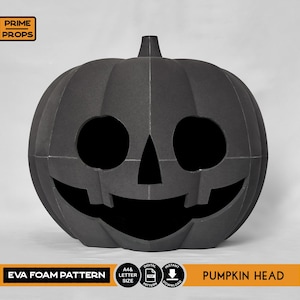 May include: A black EVA foam pumpkin head with a carved face, perfect for Halloween. The pumpkin has large eye holes and a wide, smiling mouth. The text "EVA FOAM PATTERN" and "PUMPKIN HEAD" are visible.