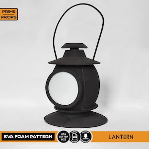 May include: Black EVA foam lantern with a round body, a circular side window, and a curved handle. The lantern has a tiered design with a base and top. Text on the image reads "EVA FOAM PATTERN" and "LANTERN".