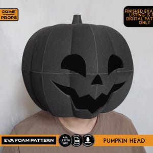 May include: A black EVA foam pumpkin head mask with carved eye and mouth openings. The mask is worn by a person. Text on the image includes "EVA FOAM PATTERN" and "PUMPKIN HEAD". The image also states "FINISHED EXAMPLE, LISTING IS FOR DIGITAL PATTERN ONLY".