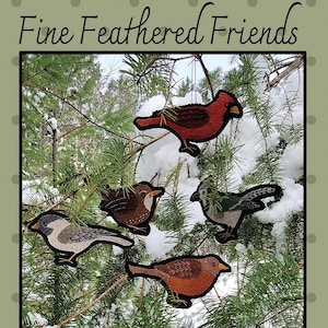 May include: Appliqued bird ornaments in various colors, including red, brown, and gray, are displayed against a snowy evergreen backdrop. The text "Fine Feathered Friends" is at the top. The finished sizes vary, approximately 3" x 6".