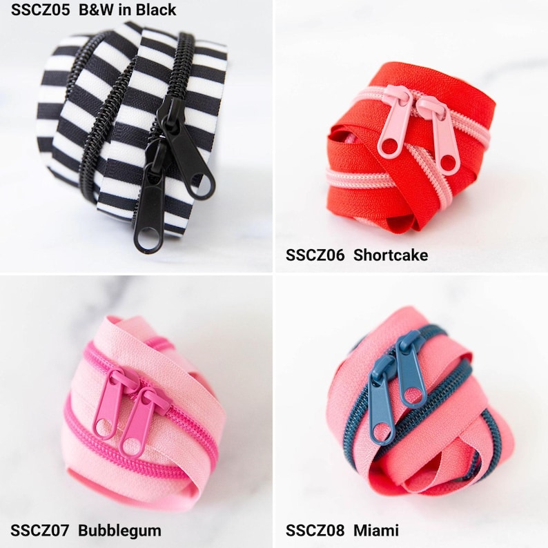 May include: Four coiled zippers labeled SSCZ05 B&W in Black with black and white stripes, SSCZ06 Shortcake in red with pink teeth, SSCZ07 Bubblegum in light pink with dark pink teeth, and SSCZ08 Miami in pink with dark blue teeth and sliders.