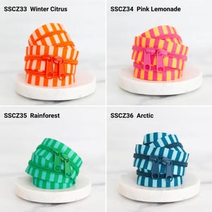 May include: Four coiled zipper tapes with striped patterns and matching pulls. SSCZ33 Winter Citrus is orange and white, SSCZ34 Pink Lemonade is pink and yellow, SSCZ35 Rainforest is green and light green, and SSCZ36 Arctic is dark blue and light blue.