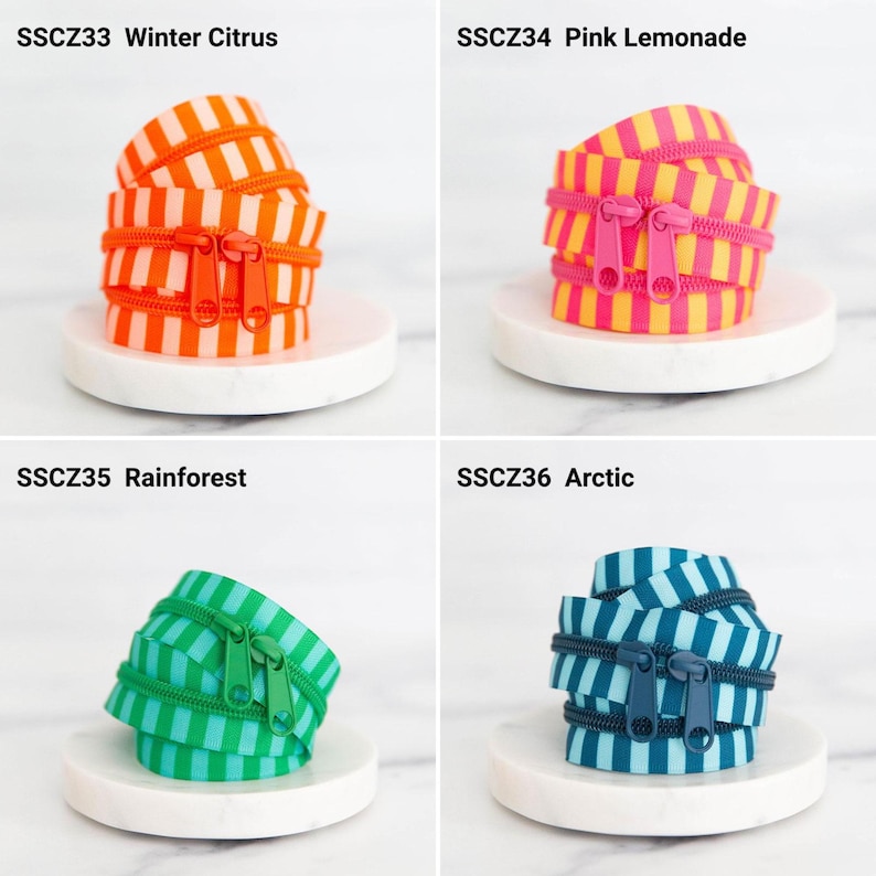 May include: Four coiled zipper tapes with striped patterns and matching pulls. SSCZ33 Winter Citrus is orange and white, SSCZ34 Pink Lemonade is pink and yellow, SSCZ35 Rainforest is green and light green, and SSCZ36 Arctic is dark blue and light blue.