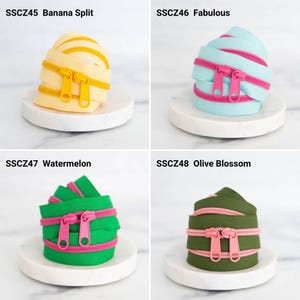 May include: Four coiled zippers with double pulls. SSCZ45 Banana Split is pale yellow with yellow pulls. SSCZ46 Fabulous is light blue with pink pulls. SSCZ47 Watermelon is bright green with pink pulls. SSCZ48 Olive Blossom is olive green with pink pulls.