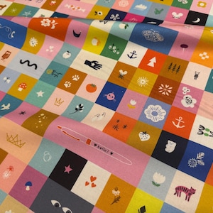 May include: A fabric featuring a grid of colorful squares in shades of pink, blue, yellow, orange, and dark navy. Each square contains a unique white or black line-art icon, including animals, plants, celestial bodies, and a pen labeled hello.