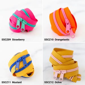 May include: Four coils of nylon zippers with metal pulls. Top left: SSCZ09 Strawberry, hot pink with teal teeth. Top right: SSCZ10 Orangetastic, orange with pink teeth. Bottom left: SSCZ11 Mustard, yellow with blue teeth. Bottom right: SSCZ12 Ochre, gold with light pink teeth.