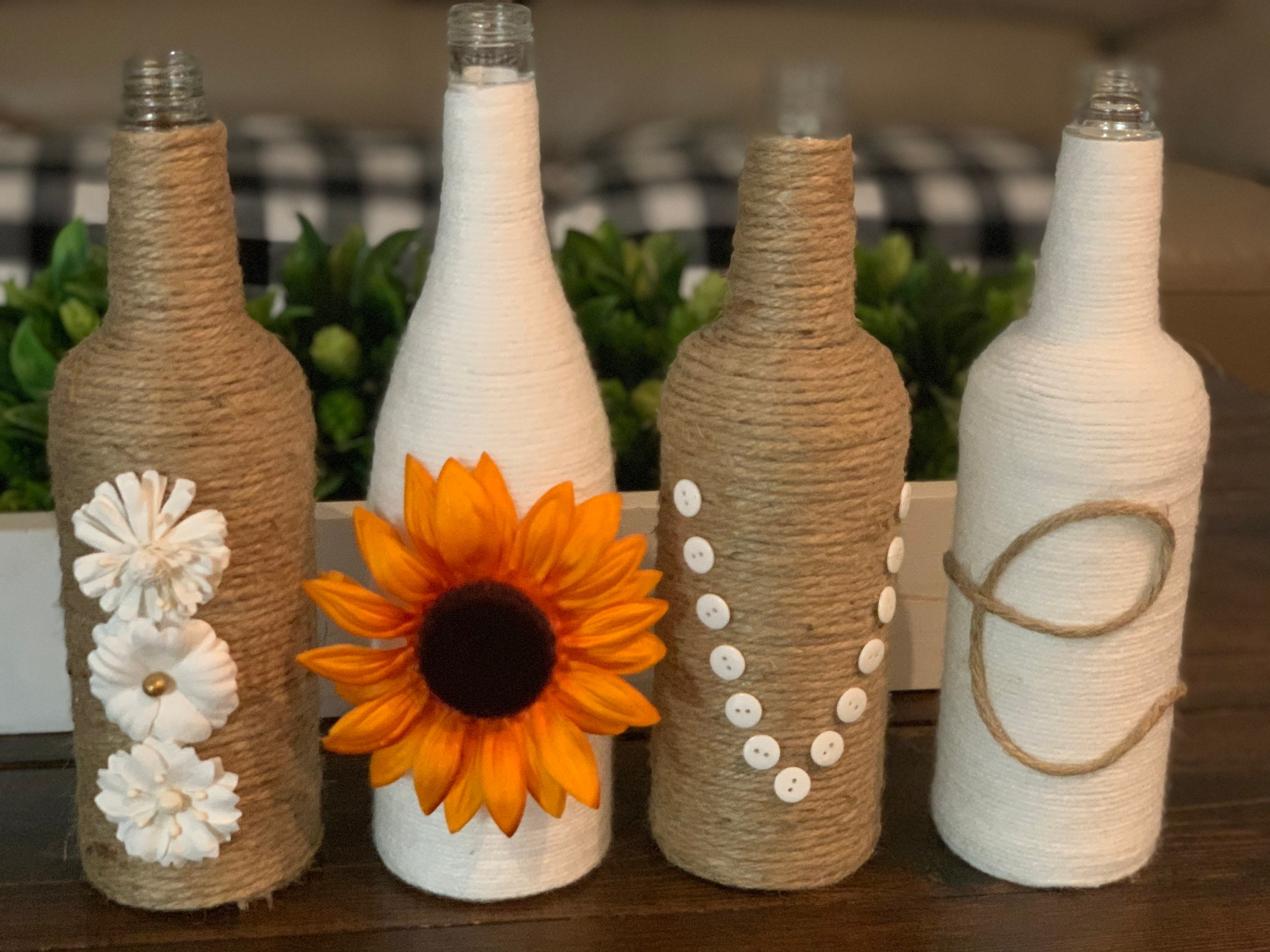 DIY wine bottle vases with colored twine - Cucicucicoo