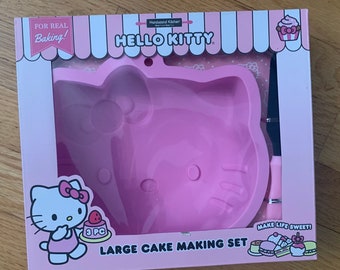 Hello kitty Sanrio 8 inch silicone cake pan 3 piece  set,new in sealed box. Silicone spatula and recipes.