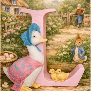 May include: A charming illustration depicting a pink letter 'J' with a duck in a blue bonnet and pink shawl, and two yellow ducklings. A rabbit in a blue jacket is also present. A cottage and garden are in the background.