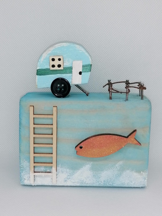 Tiny handcrafted wooden caravan scene made from reclaimed wood — a miniature piece of countryside nostalgia you can actually hold in your hand.