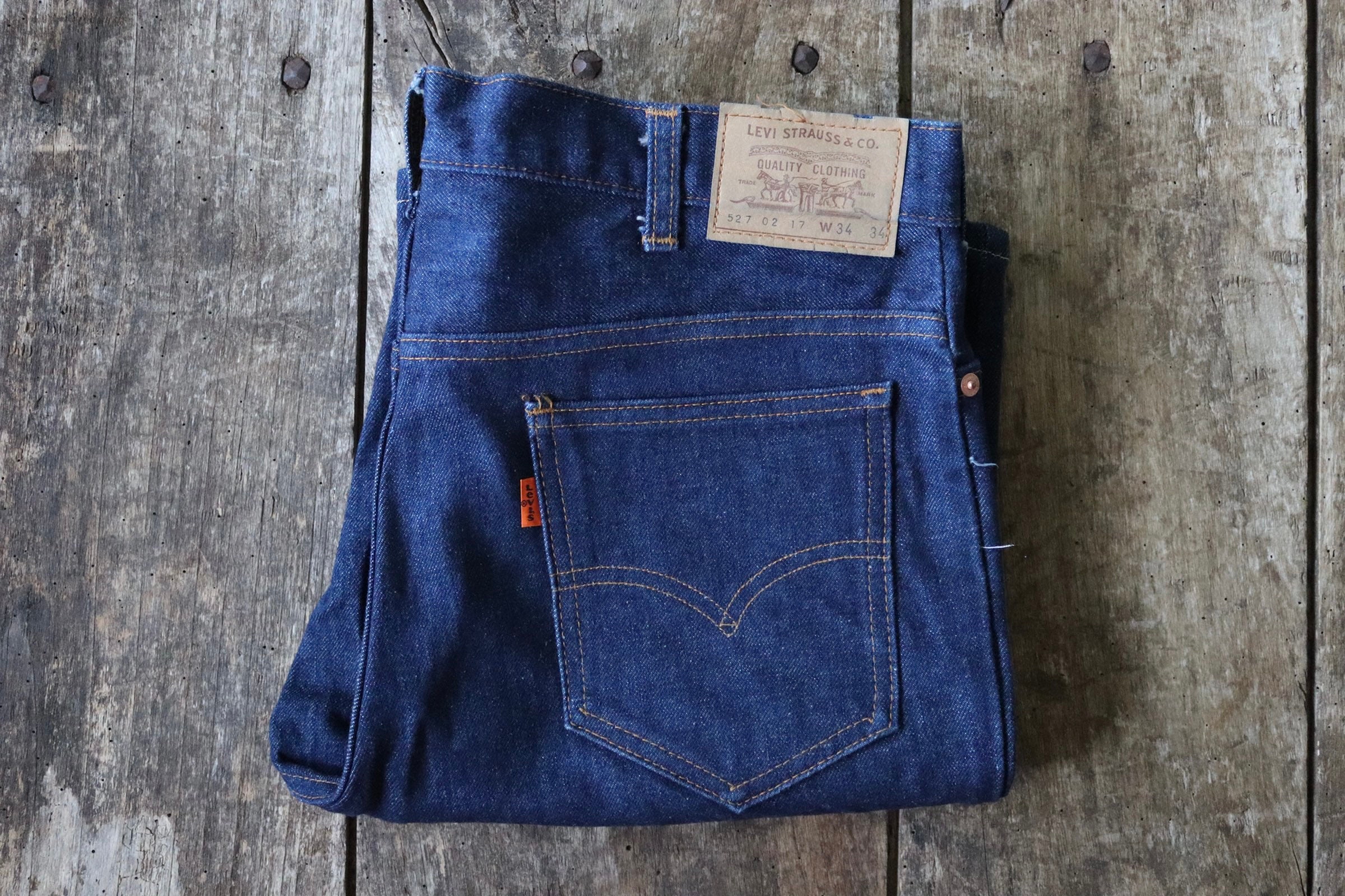 Vintage 1980s 80s deadstock Levi Strauss Levis 527 0217 denim jeans  selvedge small e orange tab made in Great Britain 33” x 30” Talon zipper