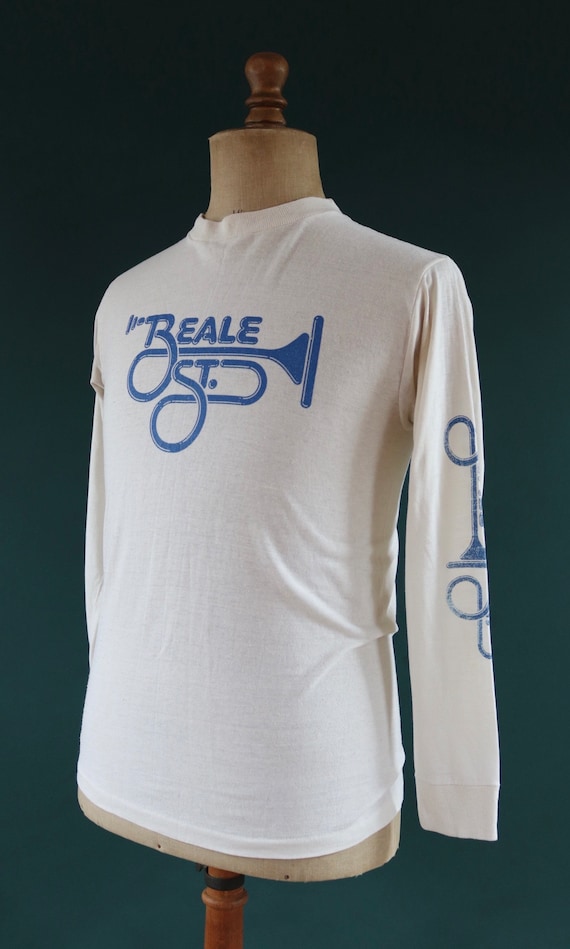 Vintage 1980s 80s white blue long sleeve 50/50 Beale Street Memphis Tennessee trumpet print sports sportswear t shirt 37” chest