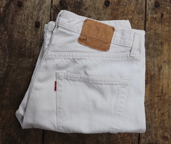 Vintage 1990s 90s Levis 501 Levi Strauss white red tab small e denim jeans button fly 32” x 29” made in France mod