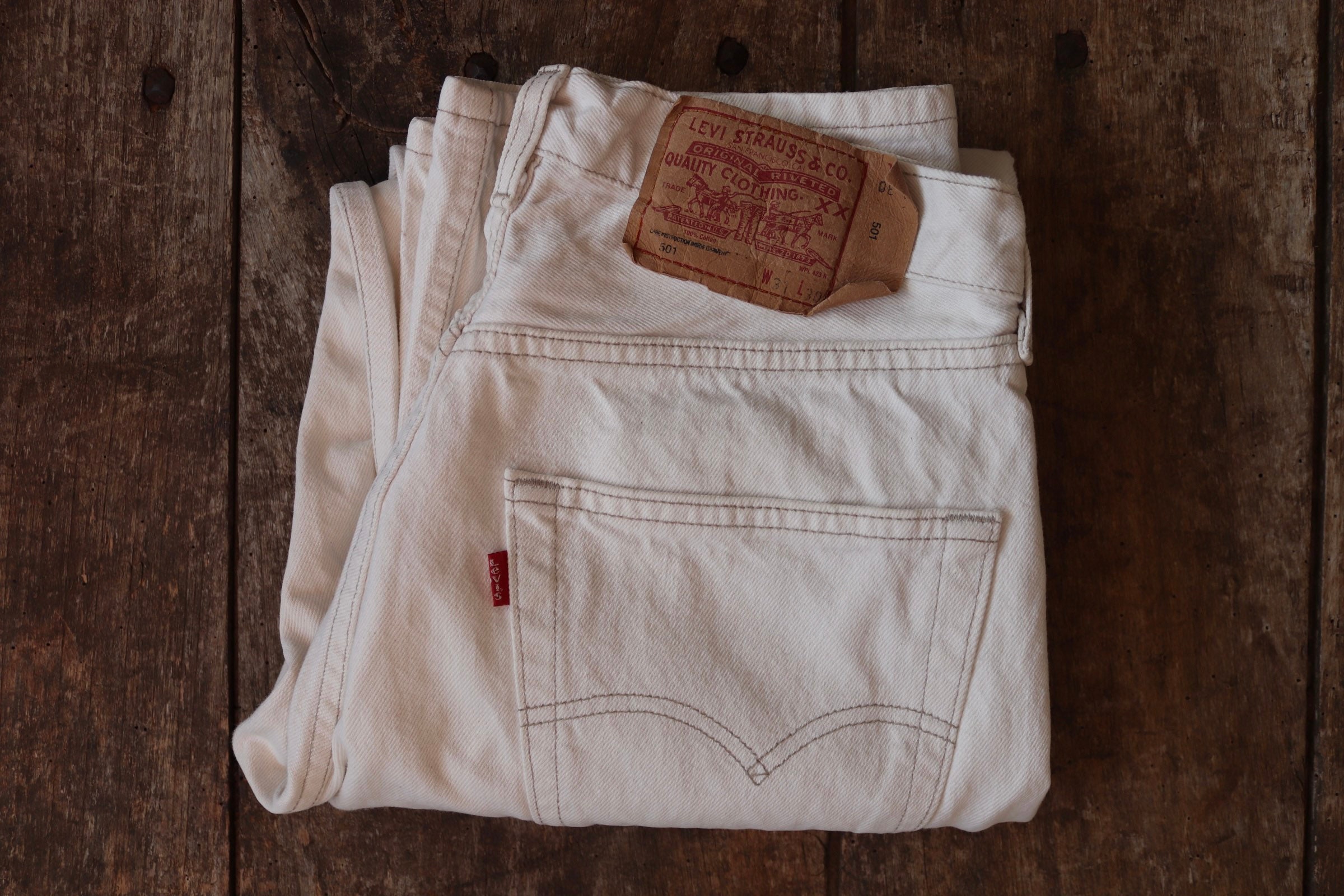 Vintage 1990s 90s Levis 501 Levi Strauss white red tab small e denim jeans  button fly 30” x 29” made in France mod