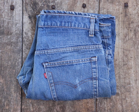 Vintage 1980s 80s Levi Strauss Levis blue 517 boot cut denim jeans small e red tab made in USA 33” x 31”