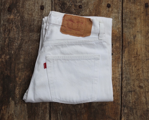 Vintage 1990s 90s Levis 501 Levi Strauss white red tab small e denim jeans button fly 28” x 33” made in France mod