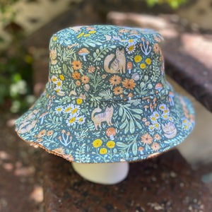 cats and mushrooms in the forest reversible bucket hat