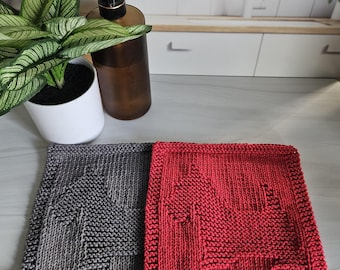 May include: Two knitted dishcloths, one gray and one red, with a tree design.