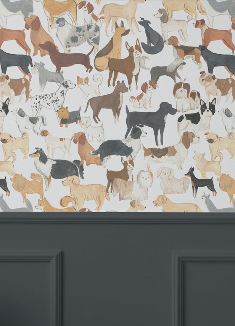 An elegant room with dark grey paneling halfway up the wall, topped with wallpaper displaying a lively assortment of painted dog illustrations in a repeat pattern.