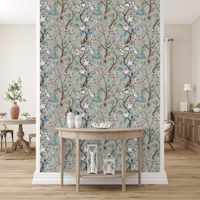 Spacious room with a console table against a wall adorned with high-quality Chinoiserie peel and stick wallpaper, showcasing delicate flower branches