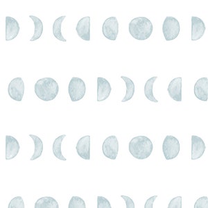 May include: A seamless pattern featuring the phases of the moon in a watercolor style. Each moon phase is depicted in a soft, muted blue-gray hue against a clean white background. The design repeats horizontally and vertically.