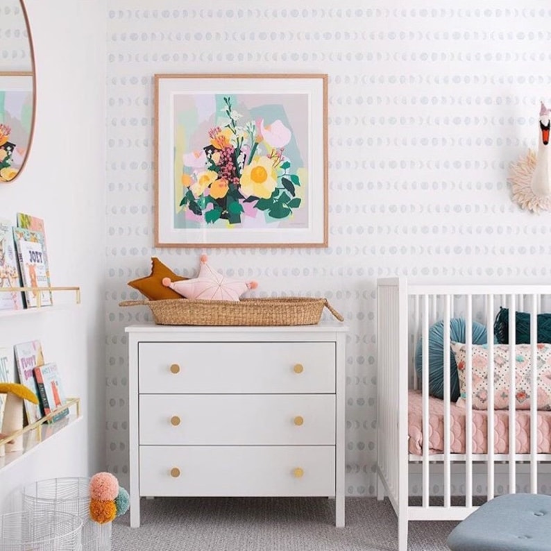 custom color blue moon wallpaper in baby nursery with crib and white dresser