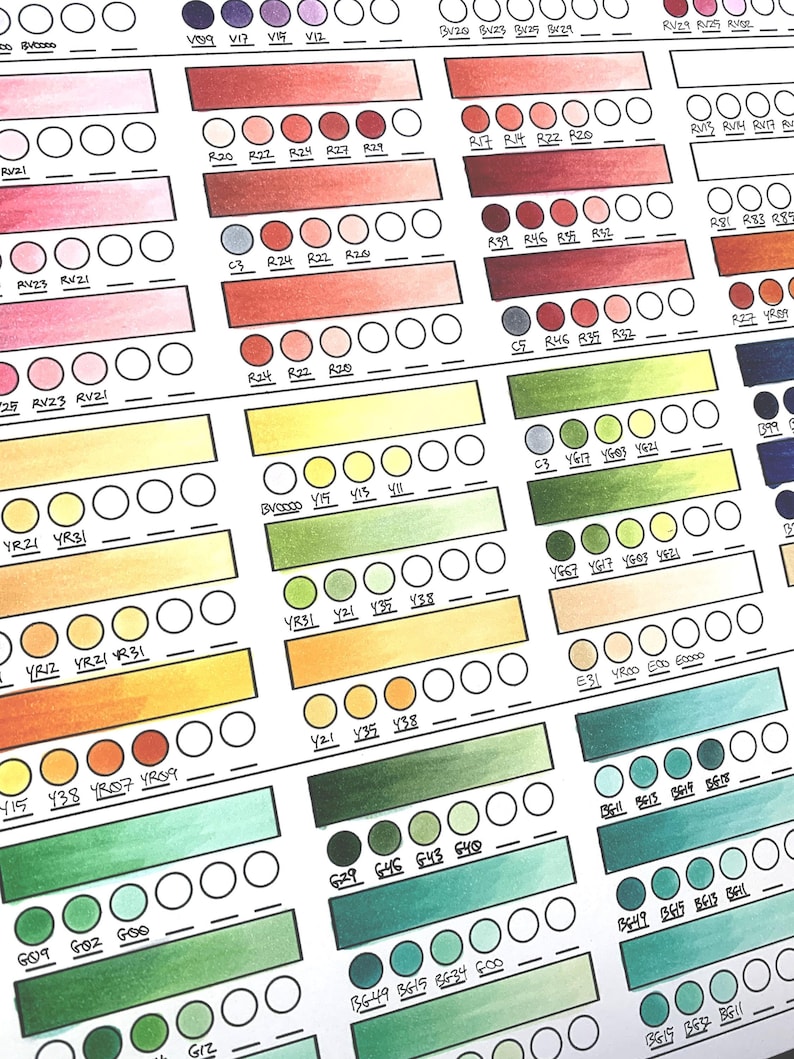 May include: A color chart with a grid of small circles filled with different shades of watercolor paint. The chart includes colors from red, orange, yellow, green, blue, and purple. The colors are labeled with numbers and letters.