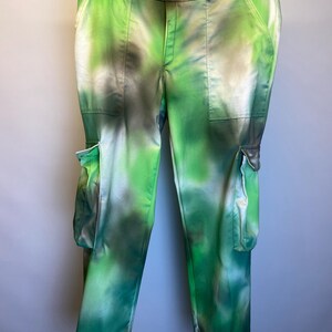 May include: Green and white tie-dye cargo pants with large pockets on the sides.
