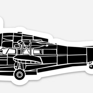 May include: Black and white silhouette of a vintage seaplane with a single propeller and floats.