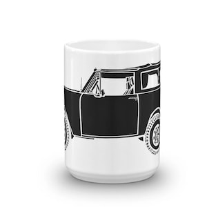 May include: White ceramic mug with a black silhouette of a vintage SUV with a roof rack. The SUV is facing the right side of the mug.