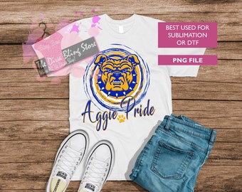 May include: White t-shirt with a blue and gold bulldog graphic and the text "Aggie Pride".