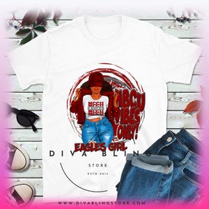 May include: White t-shirt featuring a red, white and black graphic of a woman wearing a red jacket and blue jeans. The graphic includes the text "HBCU Vibes Only!" and "Eagles Girl". The text "Diva Bling Store Est 2015" is printed below the graphic.
