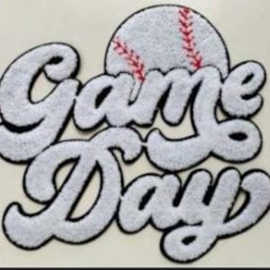 May include: White felt "Game Day" patch with a red stitched baseball graphic.