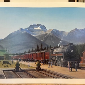May include: A vintage print depicts a black steam train at a station with red passenger cars. The scene is set against a backdrop of snow-capped mountains and a clear blue sky. People are gathered on the platform, and two moose are grazing nearby.