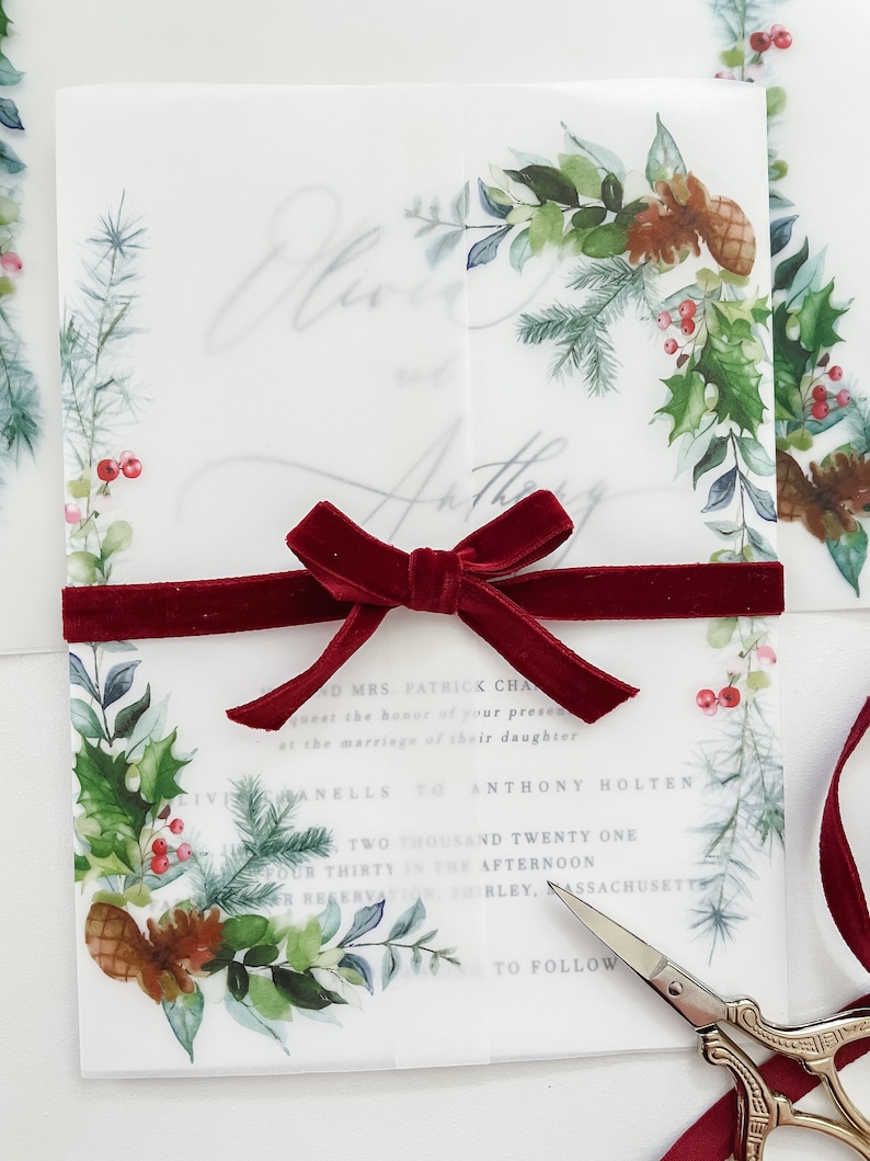 Christmas Holiday Invitation vellum jacket with Christmas designs on the corner. Vellum wrap is wrapped around a 5x7 invitation and meets in the middle. Evergreen printed designs for Christmas wedding or event invitations.