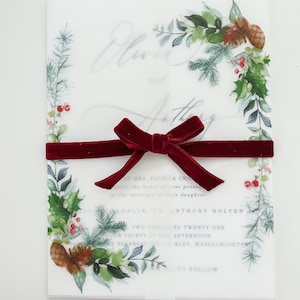 5x7 vellum jacket with evergreen designs on the corners. This clear vellum Christmas Jacket is wrapped around a 5x7 invitation and meets in the middle. Evergreen printed design to dress up your winter wedding invites.