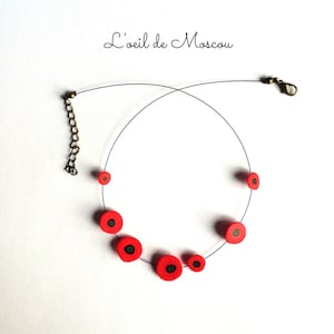 red poppy flower necklace on black thread