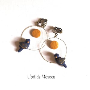 non-pierced earrings, midnight blue and gold bird in the moonlight, hand-modeled,
