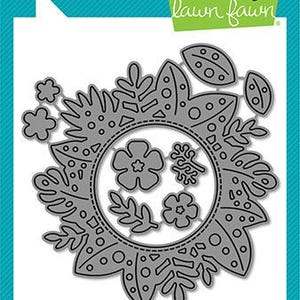 May include: A silver metal die cut of a floral wreath with tropical leaves, flowers, and geometric patterns. The die cut is designed for crafting and card making. Lawn Cuts custom craft dies.