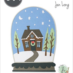 Pode incluir: Um design recortado para um globo de neve com uma casa marrom com um laço vermelho e uma coroa na porta, duas árvores verdes e um caminho sinuoso. O globo de neve está sobre um fundo azul com estrelas brancas e uma lua crescente.