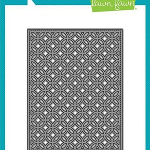 May include: A die-cut metal stencil with a repeating pattern of overlapping circles and diamonds. The stencil is gray and has a dotted border. The text "Fancy Lattice Backdrop" is printed below the stencil.