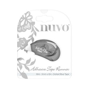 May include: A gray adhesive tape runner with the brand name "Nuvo" printed on it. The tape runner is labeled "Mini - 5mm x 6m - Dotted Blue Tape" and is packaged in a white box with a floral design.
