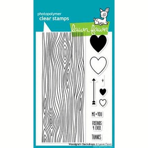May include: Clear photopolymer stamps with a woodgrain design, hearts, an arrow, and text. The text reads "ME+YOU", "FRIENDS 4 EVER", and "THANKS". The Lawn Fawn brand logo is visible.