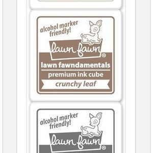 May include: A package of four Lawn Fawn premium ink cubes in various colors: Jellyfish, Crunchy Leaf, River Rock, and Jet Black. Each cube features the Lawn Fawn logo and the text "alcohol marker friendly!"