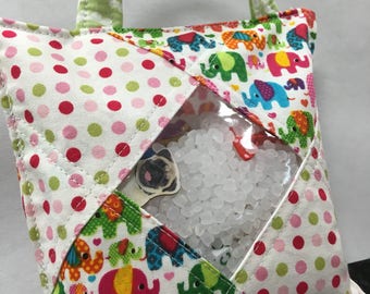 Treasure Bag filled with 30 little surprises. I spy bag great for sensory seekers.