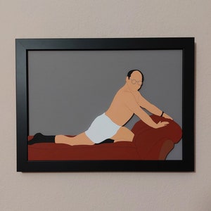 May include: A framed illustration of a man in white underwear lying on a red couch. The man is wearing glasses and has a bald head. The illustration is in a black frame.