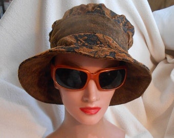 Hat, brimmed size medium 23 3/8"  in circumference bronze and black in color womens